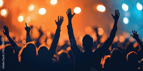 Energetic concertgoers raising hands in excitement music festival audience engagement nighttime crowd perspective photo