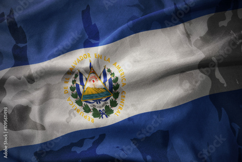 colourful waving flag of el salvador on the old army khaki texture background. military concept. photo