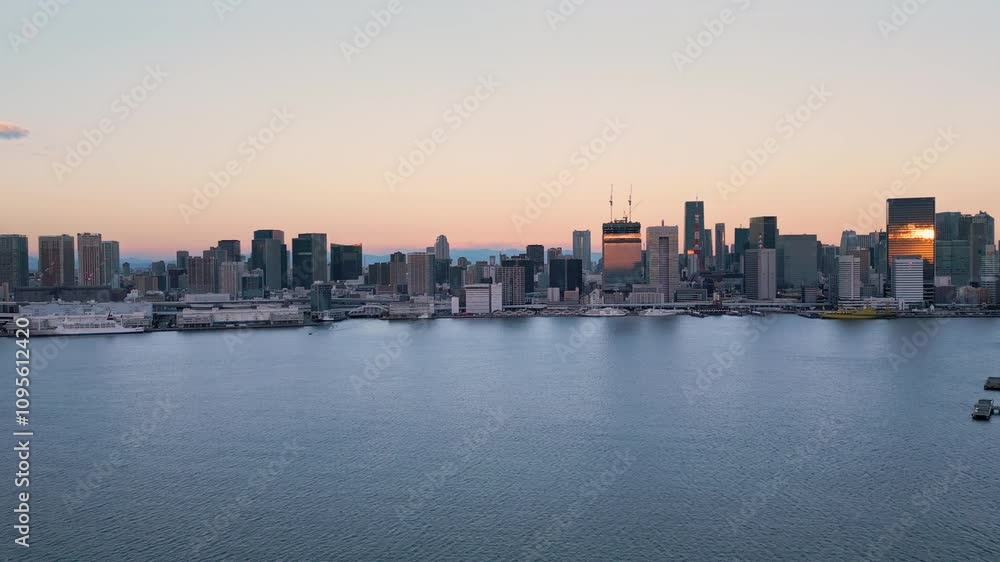 tokyo city bay aerial view drone at sunrise flying over water with modern building skyline and skyscrapers on the waterfront in the background tokyo city bay aerial view drone at sunrise flying over water with modern building skyline and skyscrapers on the waterfront in the background