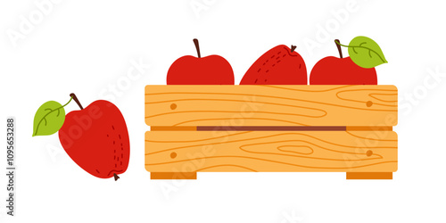 Freshly harvested apples in a wooden crate with green leaves on a sunny day