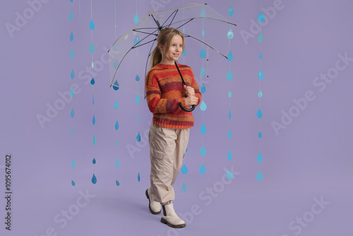 Adorable girl with umbrella...