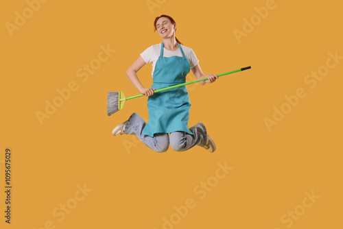 Female janitor with mop jum...