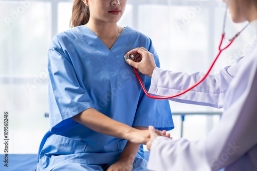A woman is being examined by a doctor