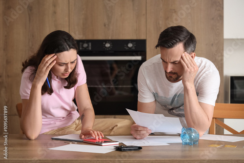 Young couple doing calculat...