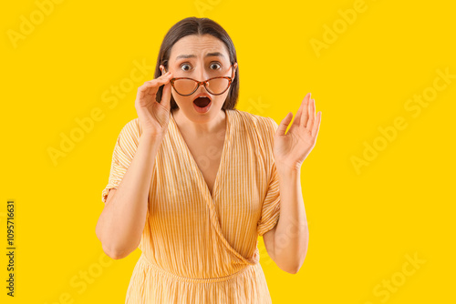 Shocked young woman in eyeg...