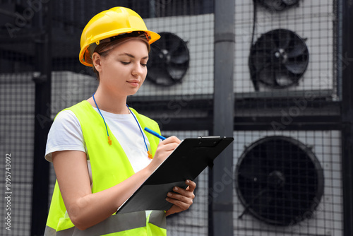 Female builder with ear plu...