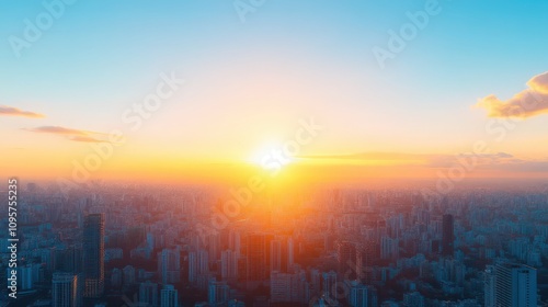 The sun is setting over a city skyline, casting a warm glow over the buildings