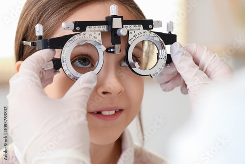 Female ophthalmologist putt...