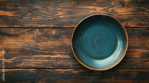 Empty ceramic bowl on rustic wood. Perfect for food blogs, menus, or restaurant websites showcasing rustic style.