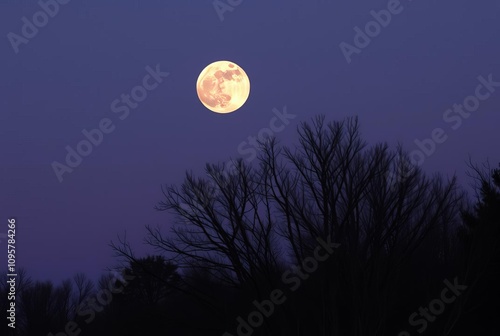 A supermoon that rises or sets during twilight creating a dramat