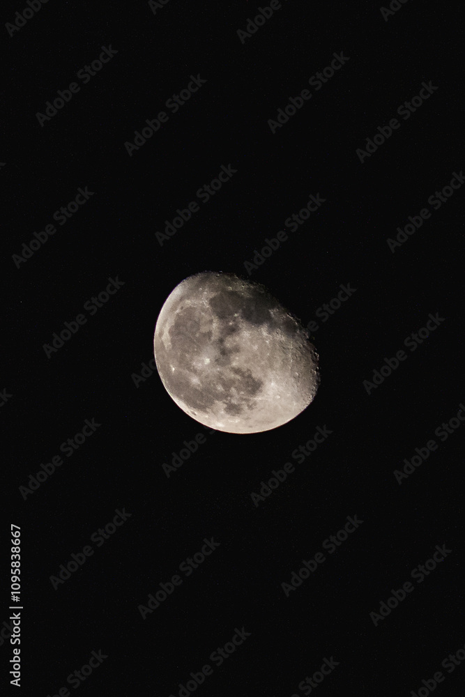 Naklejka premium Waxin gibbous or waning gibbous moon with black background