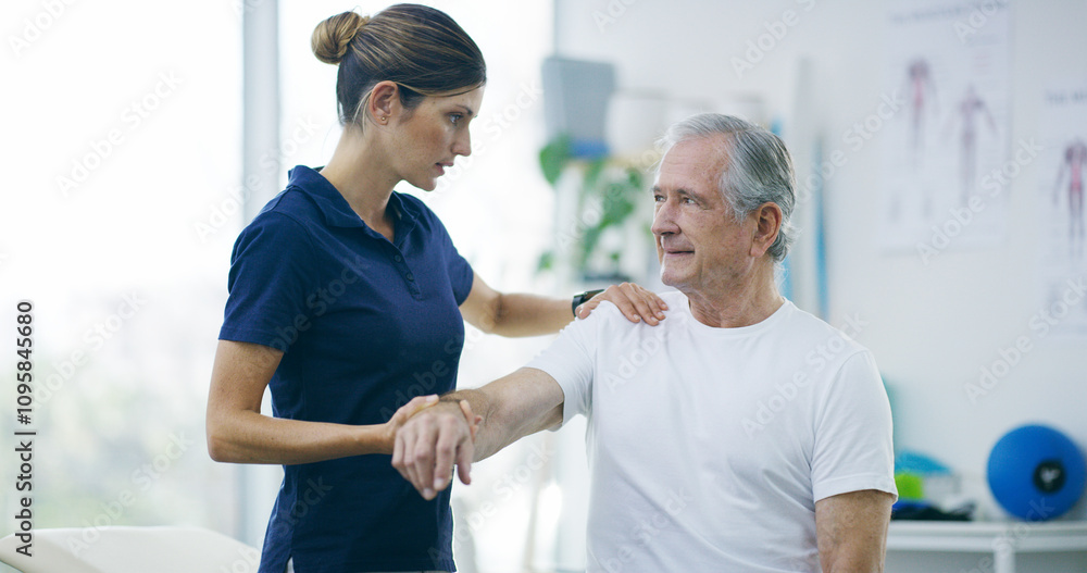 Physiotherapy, woman and senior man with shoulder pain for stretching, help and care in office. Chiropractor, elderly patient or advice in practice for rehabilitation, healing or arm exercise in exam Physiotherapy, woman and senior man with shoulder pain for stretching, help and care in office. Chiropractor, elderly patient or advice in practice for rehabilitation, healing or arm exercise in exam