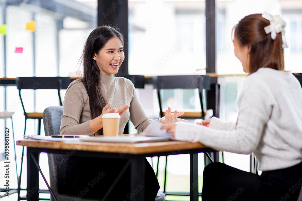Two asian confident business people point to graphs and charts to analyze market data, balance sheet, account, net profit to plan new sales strategies to increase production capacity.
Two asian confident business people point to graphs and charts to analyze market data, balance sheet, account, net profit to plan new sales strategies to increase production capacity.