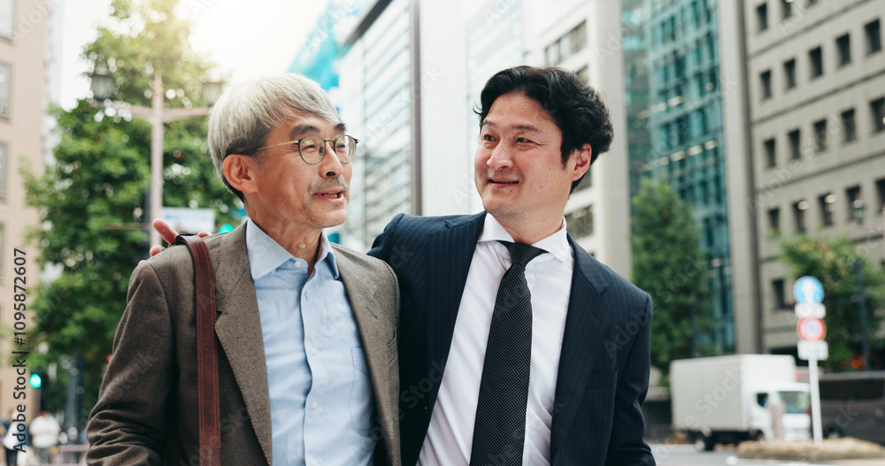 Asian, walking and business people in city talking for conversation, travel or bonding. Smile, discussion and professional Japanese colleagues speaking of urban project together commuting in Tokyo Asian, walking and business people in city talking for conversation, travel or bonding. Smile, discussion and professional Japanese colleagues speaking of urban project together commuting in Tokyo