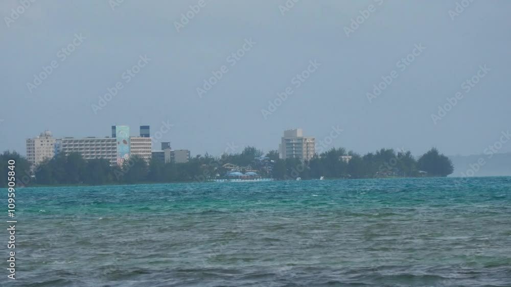 Different shades of water with hotel buildings in view, Garapan, Saipan, CNMI Different shades of water with hotel buildings in view, Garapan, Saipan, CNMI