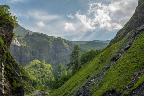 Peaceful mountain trail in majestic Swiss Alps in summer, Batoni Waterfalls valley