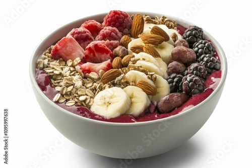 Acai bowl with fruit, nuts, and granola.