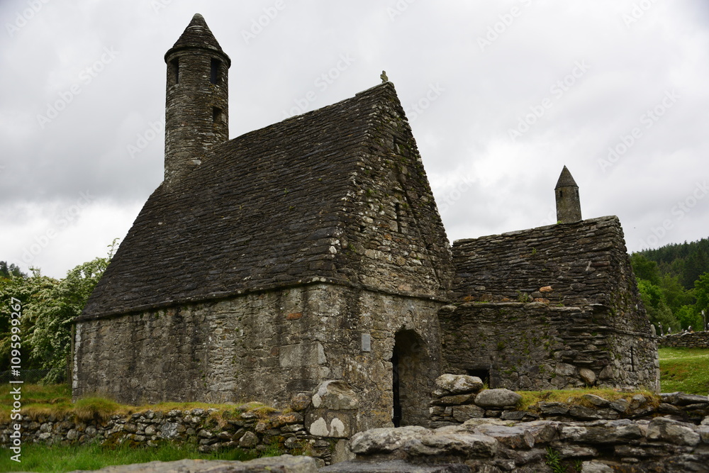 Ancient stone abbey ruins with a graveyard under cloudy skies. Republic of Ireland Ancient stone abbey ruins with a graveyard under cloudy skies. Republic of Ireland