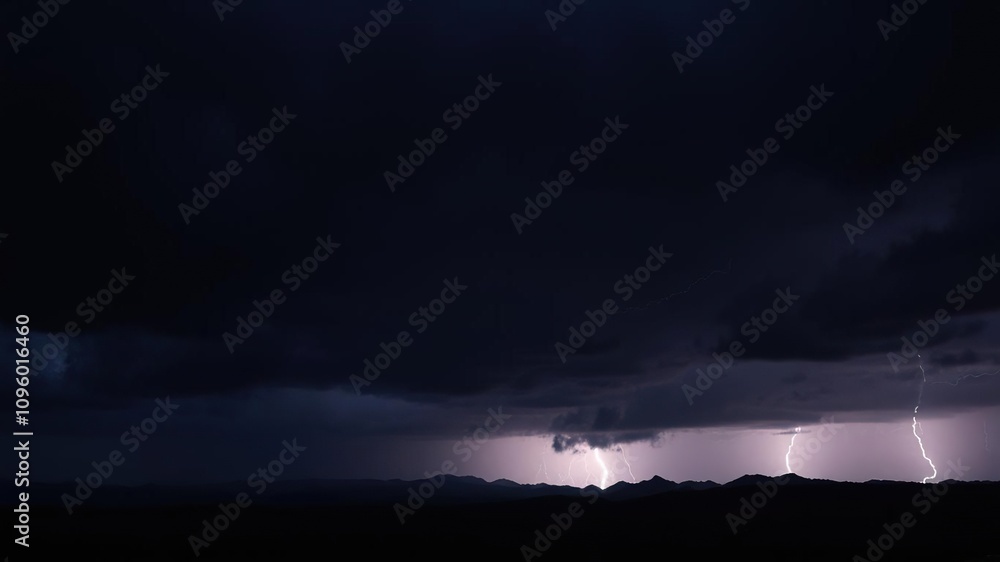 Dark and stormy night sky with lightning illuminating a distant mountain range, lightning, mountain range Dark and stormy night sky with lightning illuminating a distant mountain range, lightning, mountain range