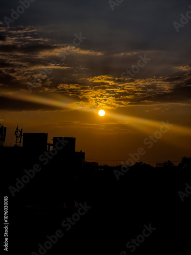 Orange light of setting sun illuminating the skyscrapers and high-rise buildings in Bangalore, India.