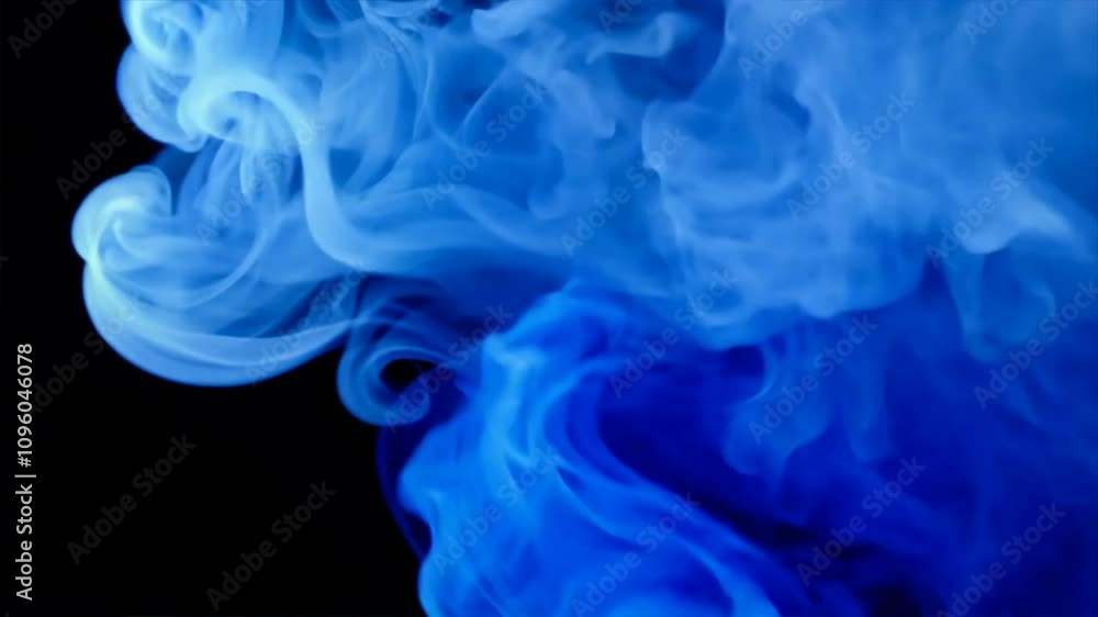 Swirling blue smoke creates abstract and artistic background, showcasing fluid motion and texture that evokes mystery and depth in dynamic design. Swirling blue smoke creates abstract and artistic background, showcasing fluid motion and texture that evokes mystery and depth in dynamic design.