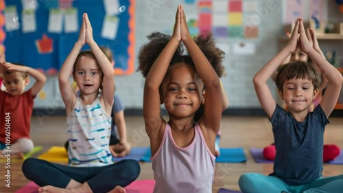 Group of children doing yoga in a classroom, highlighting education and fun