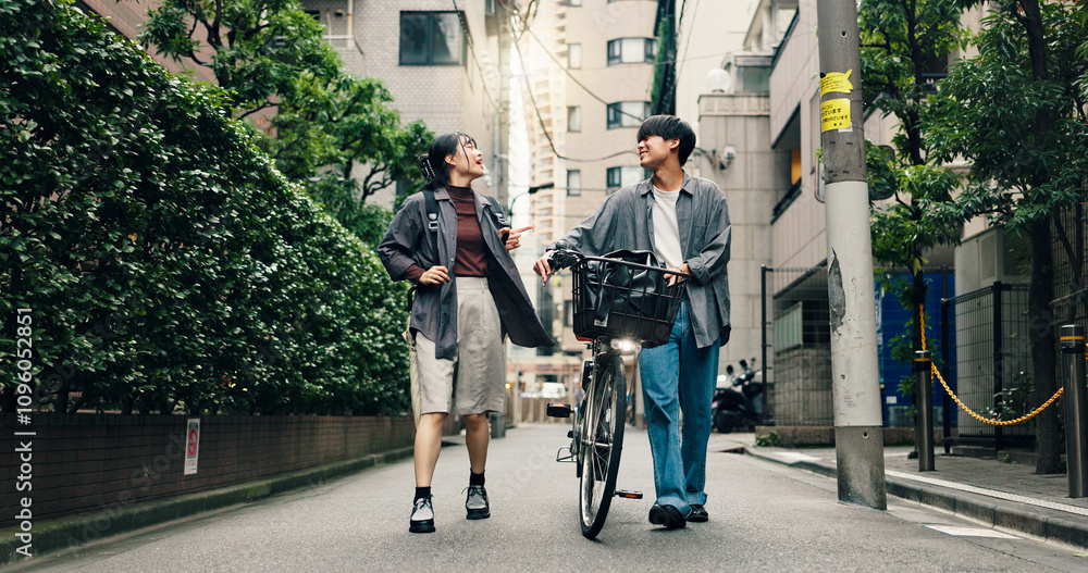 Obraz premium Fashion, walking and bike with Japanese couple in city for streetwear, genz style and travel. Date, urban and love with asian man and woman talking in outdoors for bonding, casual and cool together