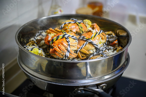 Steamed Yangcheng lake hairy crabs in a pot for family dinner. photo