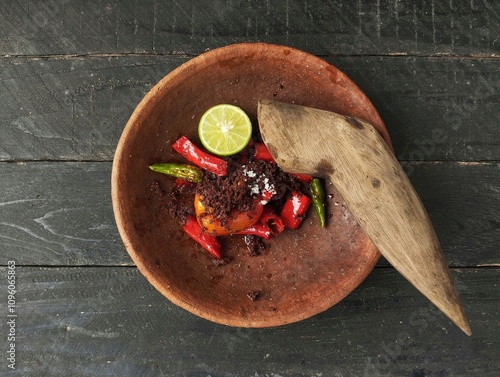 Sambal terasi or Chili shrimp paste on wooden table. indonesian traditional foods  photo