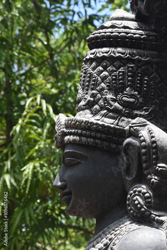 beautiful sculpture statue idol of woman Hindu goddess made in single stone rock SITTANAVASAL STATUE PUDUKKOTTAI photo