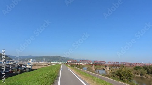Wallpaper Mural A first-person video of cycling on the Kyo-Nara-Wakayama (Keinawa) Cycling Road in Kyoto, Japan. Captured under a clear blue sky, showcasing scenic views and the joy of outdoor activity Torontodigital.ca