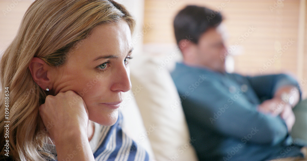 Annoyed, argument and conflict with couple on sofa in living room of home for marriage frustration. Depression, ignore and loneliness with woman thinking about breakup or divorce in apartment Annoyed, argument and conflict with couple on sofa in living room of home for marriage frustration. Depression, ignore and loneliness with woman thinking about breakup or divorce in apartment