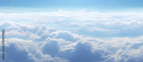 Stunning aerial view of soft clouds from an airplane window showcasing the beauty of sky and atmosphere amidst serene blue hues.