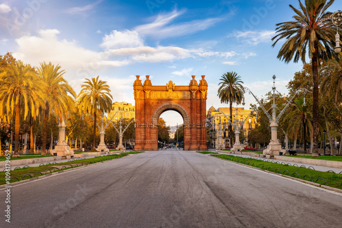 Beautiful view of the landmark Arc de Triomf in Barcelona, Spain, during golden sunrise without people photo