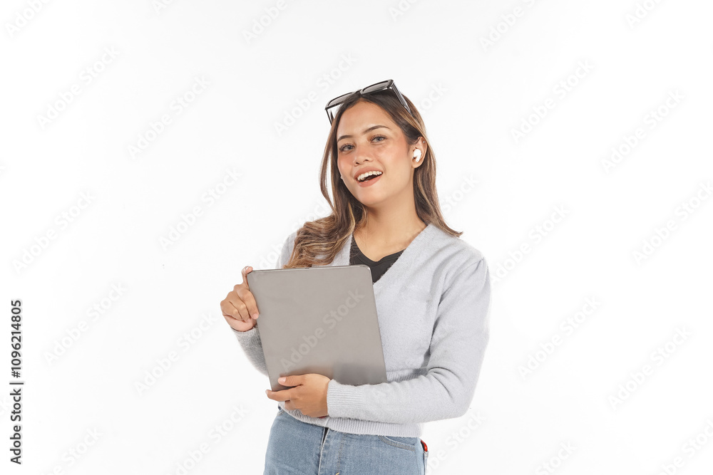 Young Asian woman smiling wearing airpods and glasses holding tablet while looking at camera Young Asian woman smiling wearing airpods and glasses holding tablet while looking at camera