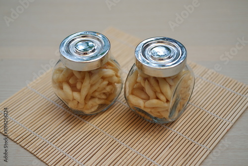 telur gabus sticks in a jar on wooden table photo