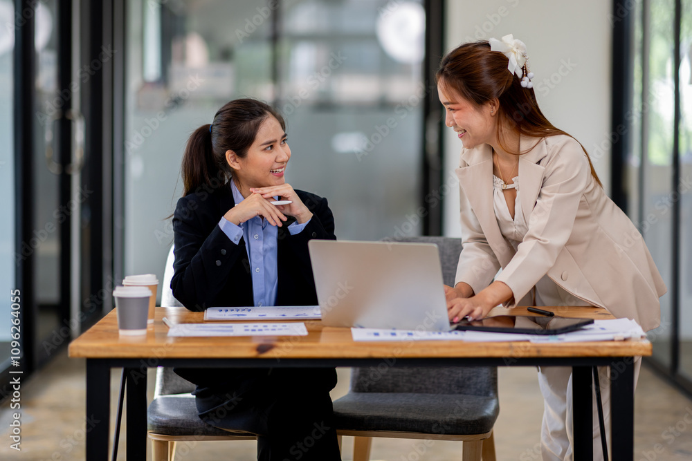 Two asian business women Accounting using calculating income-expenditure and analyzing real estate investment documents data report Financial and tax systems concept. Two asian business women Accounting using calculating income-expenditure and analyzing real estate investment documents data report Financial and tax systems concept.