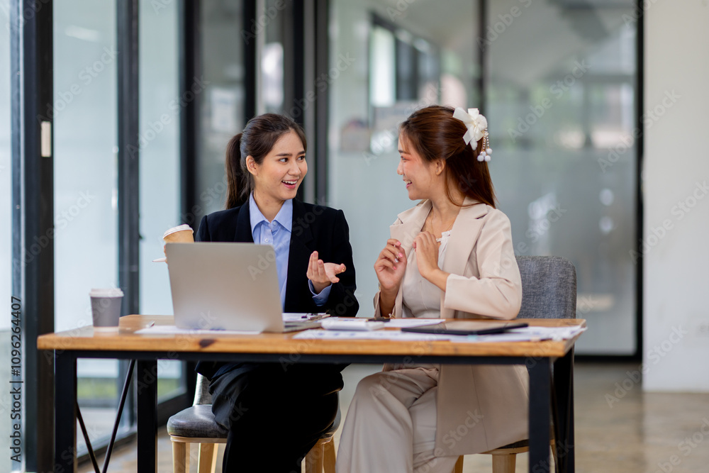 Two asian business women Accounting using calculating income-expenditure and analyzing real estate investment documents data report Financial and tax systems concept. Two asian business women Accounting using calculating income-expenditure and analyzing real estate investment documents data report Financial and tax systems concept.