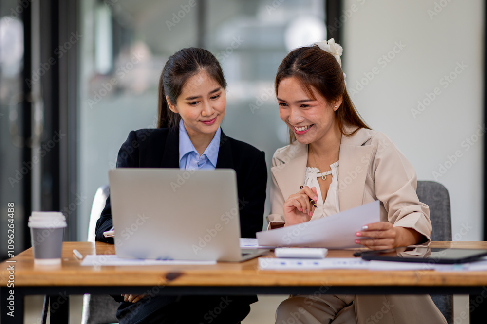 Two asian business women Accounting using calculating income-expenditure and analyzing real estate investment documents data report Financial and tax systems concept.