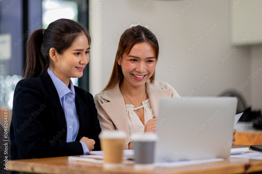 Two asian business women Accounting using calculating income-expenditure and analyzing real estate investment documents data report Financial and tax systems concept. Two asian business women Accounting using calculating income-expenditure and analyzing real estate investment documents data report Financial and tax systems concept.