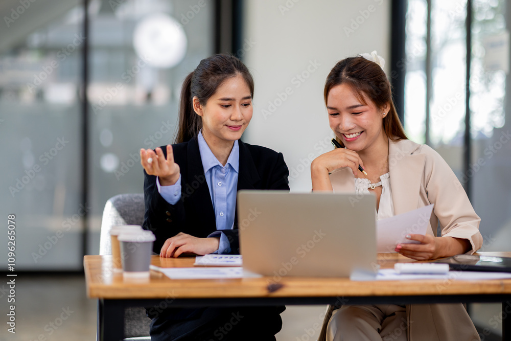 Two asian business women Accounting using calculating income-expenditure and analyzing real estate investment documents data report Financial and tax systems concept. Two asian business women Accounting using calculating income-expenditure and analyzing real estate investment documents data report Financial and tax systems concept.