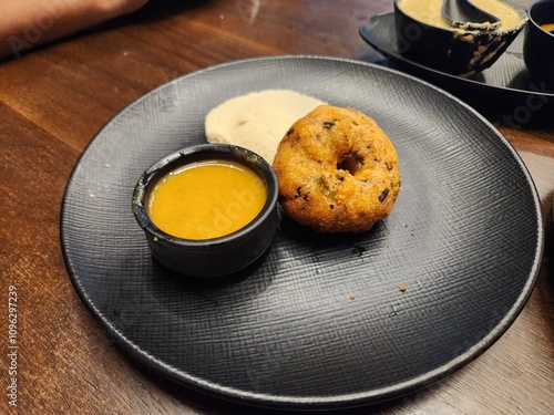 Visakhapatnam, Andhra Pradesh India- Nov 01 2024: South Indian food - Idli, Mendu wada and Chutney in a restaurant photo