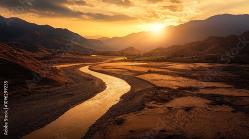 Dry, cracked landscape with parched riverbeds under a dramatic sunset, illustrating the severe impact of prolonged drought conditions.