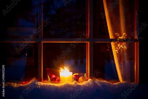 Snowy Wooden Window, Candles and Christmas Decoration