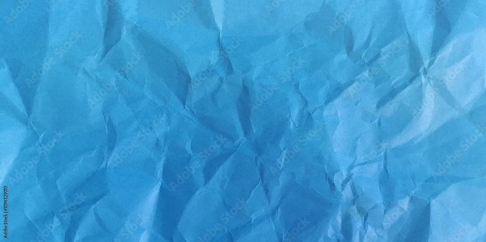 Crumpled blue paper background texture