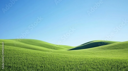 Aerial view of rolling green hills with a clear blue sky, creating a serene and natural land background