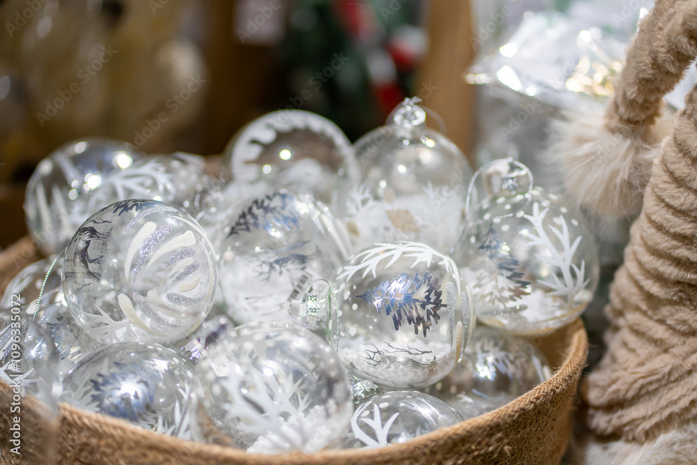 Many transparent glass Christmas balls in a beige textile basket Many transparent glass Christmas balls in a beige textile basket