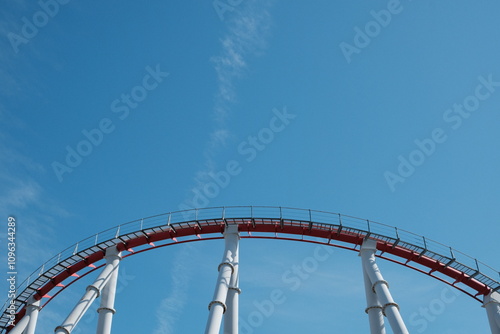 coaster ride in park, blue sky, go uphill photo