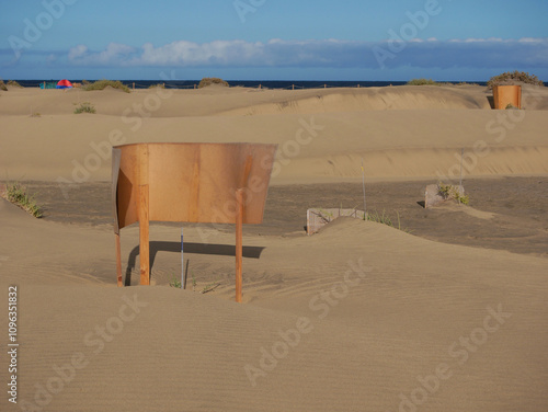 Special fence barriers for conservation ecosystem plants of dune in Maspalomas, Gran Canaria. Natural reserve to protect Traganum Moquinii plant, which helps to form dunes and regulate sand movement photo