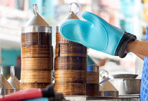 Preparing traditional Dim Sum in a street restaurant photo